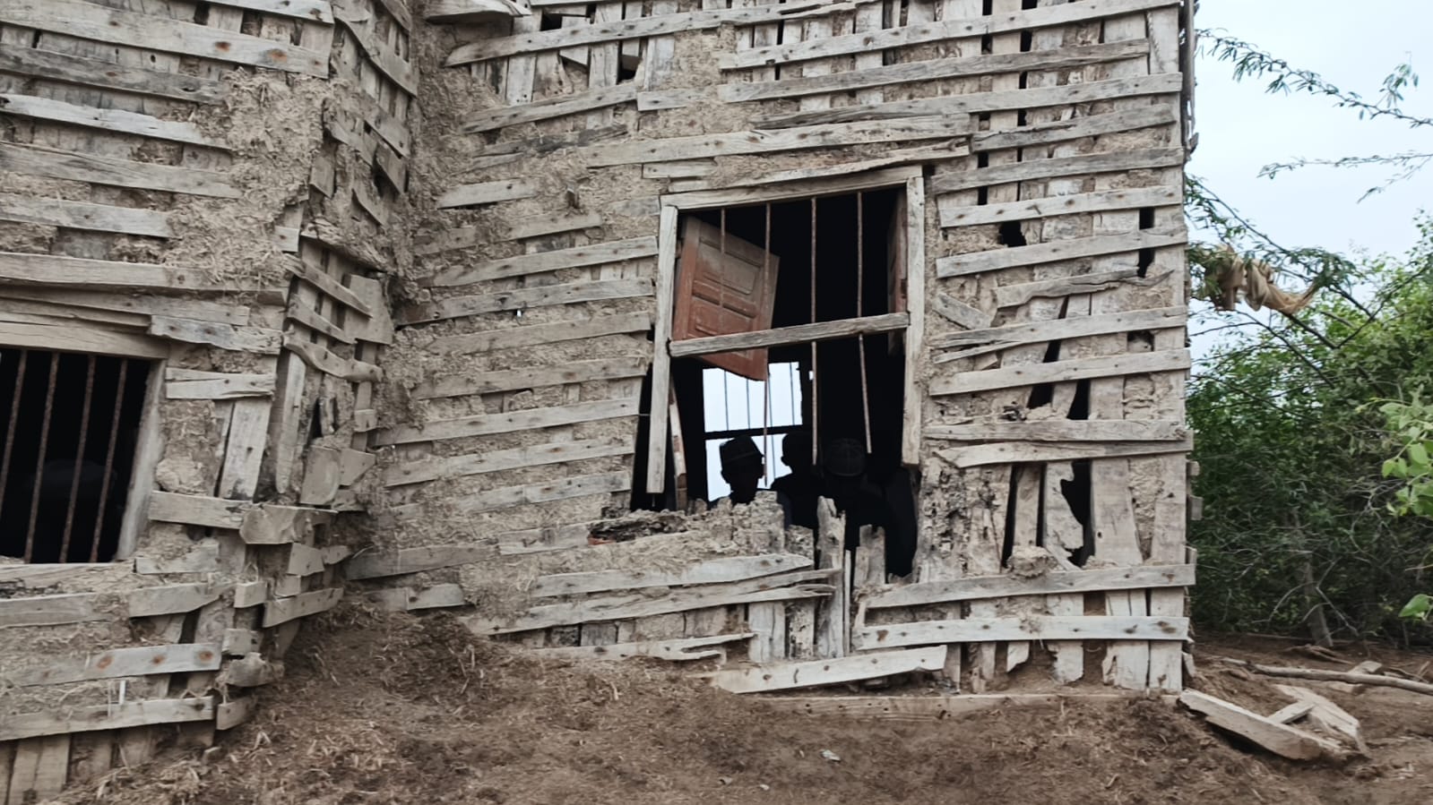 The crumbling walls and windows of the old mosque