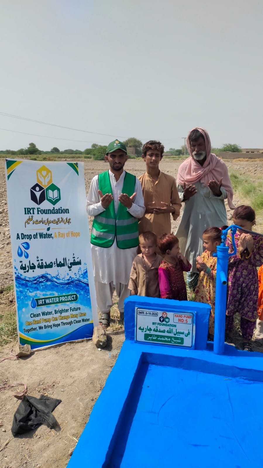 Villagers thanking after a solar hand pump sadaqah jariyah water well was installed by IRT Welfare Foundation